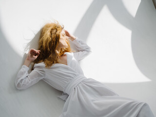 Naklejka premium attractive woman in white dress posing isolated background glamor