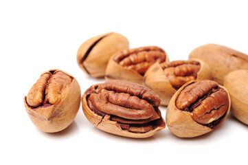 Peeled pecan nuts closeup, isolated on white background
