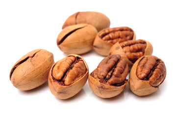 Peeled pecan nuts closeup, isolated on white background