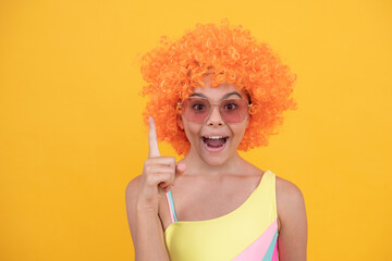child in sunglasses and swimsuit inspired with idea on yellow background, inspiration.