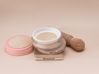 Women's secrets. Decorative cosmetics: powder ,brush, face sculpture . Make up