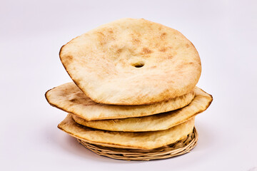 Highlight the Arabic Bread - Lavash-on a white background. Four pita bread, simple bread to eat