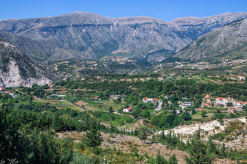 Fototapeta na wymiar Summer landscape -Albanian mountains, covered with green trees and blue sky