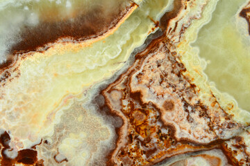 The texture of the stone is onyx, a kind of agate. Yellow, brown, green mineral layers 