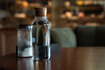 bottle of still water on table in cafe