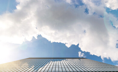 Office buildings. Finance corporate architecture city in abstract blue sky with nature cloud in sunny day. Modern office business building with glass, steel facade exterior.