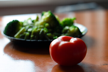 fresh vegetables, tomato and broccoli on a plate