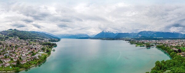 360 degree panorama view on lake of Thun (Thunersee, Thuner See), alps mountains, Castle Schadau....