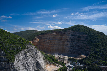 Panorama of developed mountain fossils. Italian marble quarries. Aerial view of an abandoned marble...