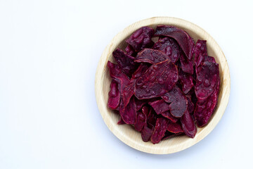 Purple sweet potato chips on white