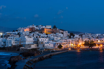 Fototapeta na wymiar Night view of the Port of Naxos on the west coast of the Greek island of the same name in the Cyclades archipelago