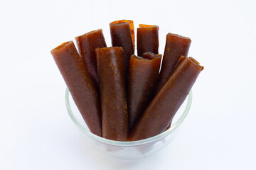 Dried mango paste on white background.