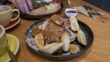 Banana pancakes brunch in a cafe