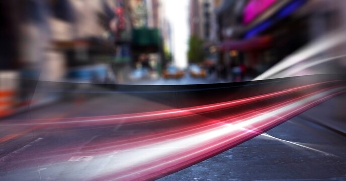 Digital composite image of red digital waves against view of city traffic