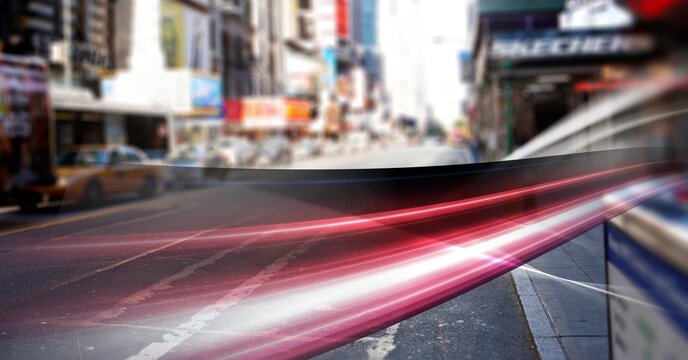Digital composite image of red digital waves against view of city traffic