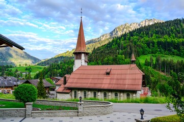 Fototapeta premium Church in Jaun, alps mountains, Canton Fribourg, Freiburg nearby Bulle, Bern, Thun. Good hiking tourist way. Switzerland.
