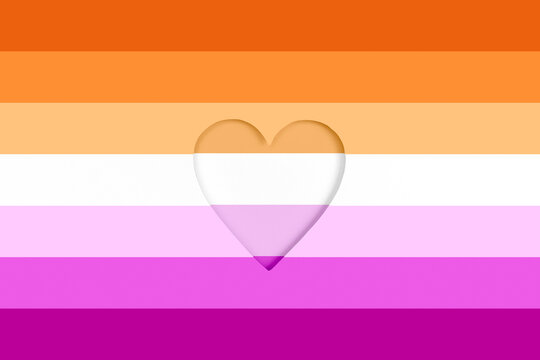 Lesbian flag background. Rainbow Printed cardboard with die-cut heart shape. Top view
