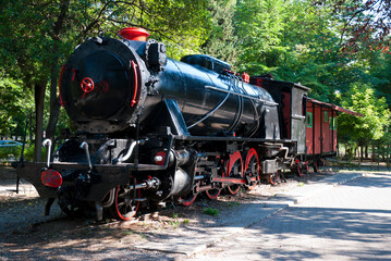Obraz premium Tripoli, Peloponnese, Greece - June 24, 2021: Antique 1800's steam train at Areos park.