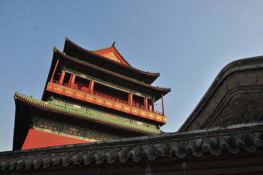A corner of the ancient Chinese drum and bell tower during the golden sunset hour in winter. Beijing, China