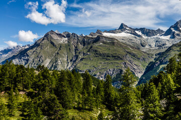 Mountain Panorama in the Swiss Alps, cloudy sky.