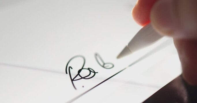 4K Video close up stylus sign signature on tablet screen. Concept for digital e-signature and electronic document.
