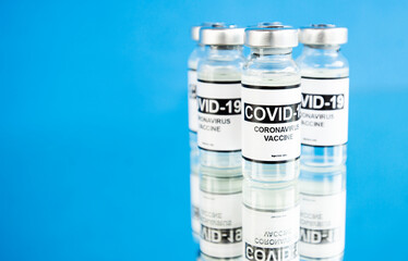 Covid-19 coronavirus vaccine on the blue background