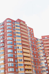 windows on colorful building, red brick multi-storey house, brick house,