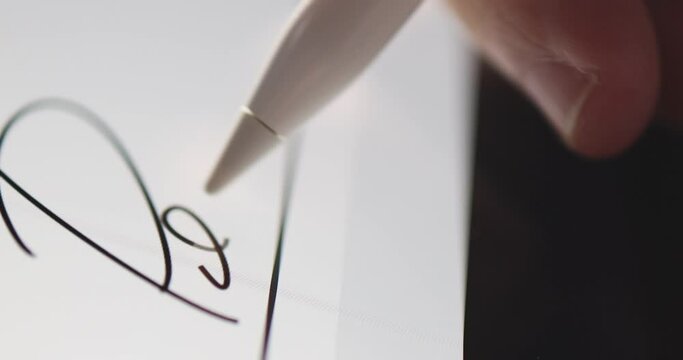 4K Video close up stylus sign signature on tablet screen. Concept for digital e-signature and electronic document.