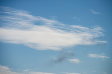 Naklejka na ściany i meble View of cirrus clouds on blue sky background