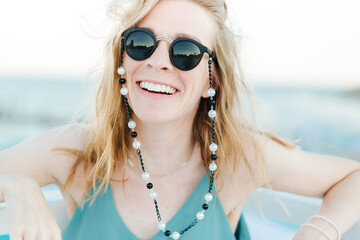 Smiling girl in sunglasses outdoors