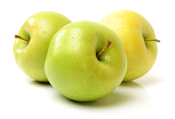 three green apples on white background.