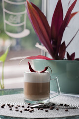 Cup of coffee with pepper on the coffee table in the cafeteria