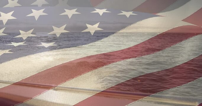 American flag waving against portrait of view of ocean from a boat