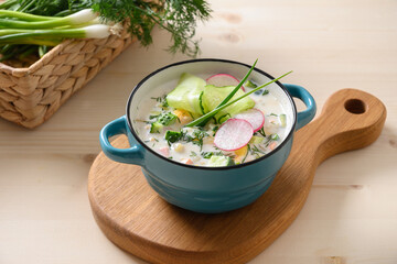 Russian summer okroshka soup with kefir. Freshness okroshka made of summer chopped vegetables,...