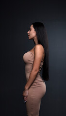 Fototapeta premium portrait of a young woman in the studio on a dark background