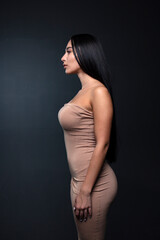 Fototapeta premium portrait of a young woman in the studio on a dark background