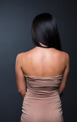 Fototapeta premium portrait of a young woman in the studio on a dark background