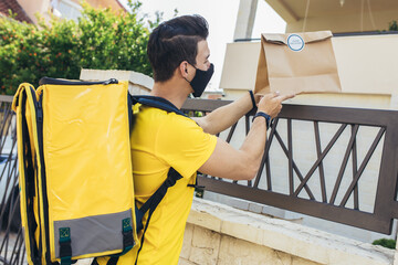 Young man delivering online grocery order.