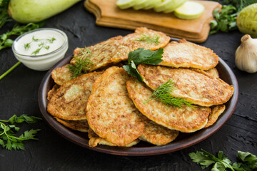 A healthy breakfast of zucchini pancakes. Creative atmospheric decoration
