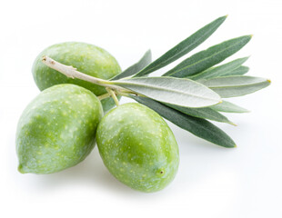 Green natural olives with leaves isolated on a white background.