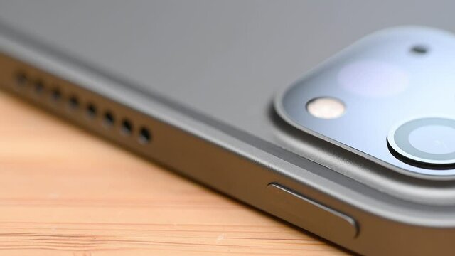Close up of lidar sensor and two cameras lens on new model of flagship tablet 5G with wifi isolated on white background.