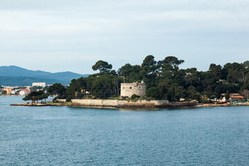 The bay of the city of Toulon in France with an old fortress on the shore of the bay.