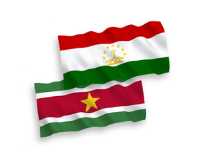 National vector fabric wave flags of Republic of Suriname and Tajikistan isolated on white background. 1 to 2 proportion.