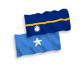 National vector fabric wave flags of Republic of Nauru and Somalia isolated on white background. 1 to 2 proportion.
