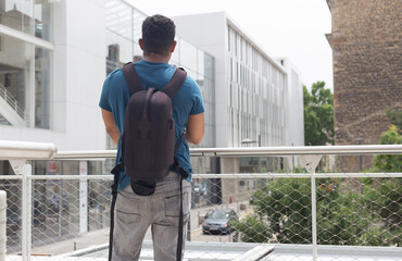 Latin tourist man in Europe with his smartphone