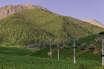 empty mountain cable car lift in summer