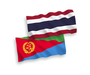 National vector fabric wave flags of Eritrea and Thailand isolated on white background. 1 to 2 proportion.