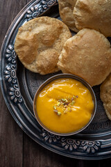 Aam Ras Puri or Alphonso Mango pulp with fried Poori