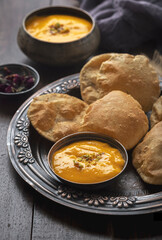 Aam Ras Puri or Alphonso Mango pulp with fried Poori
