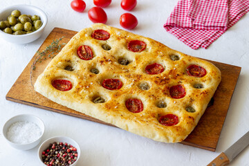 Focaccia with tomatoes and olives. Vegetarian food. Italian food.